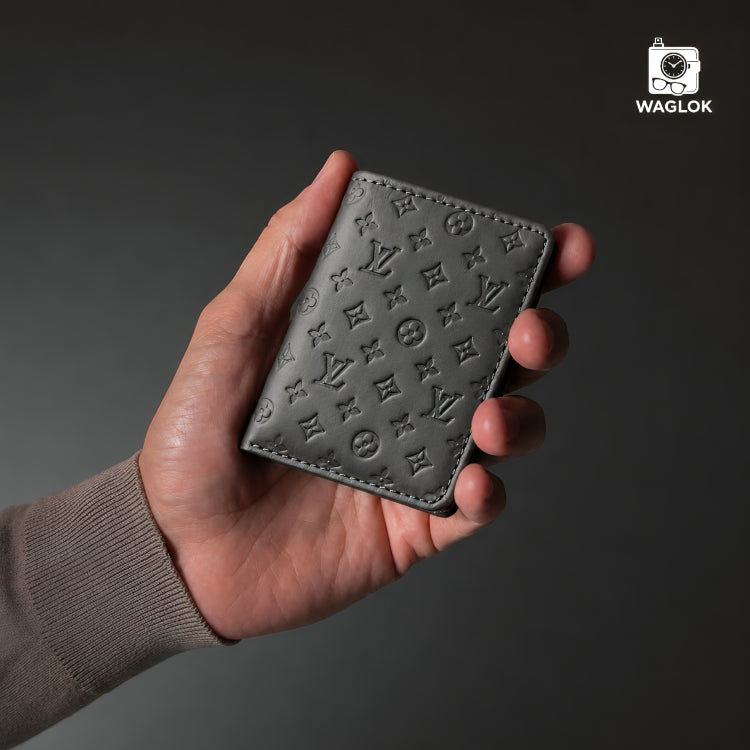 Beige slim wallet with embossed monogram pattern