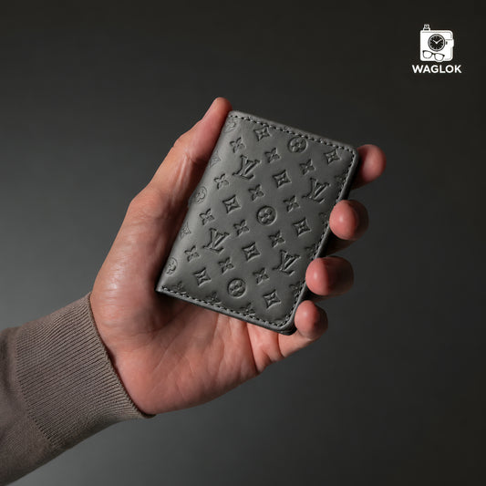 Beige slim wallet with embossed monogram pattern