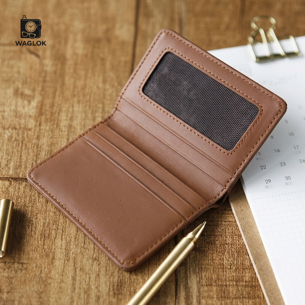 Beige slim wallet with embossed monogram pattern