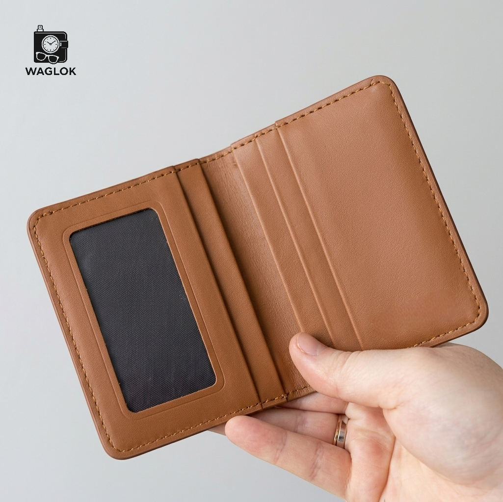 Beige slim wallet with embossed monogram pattern