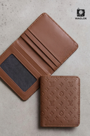Beige slim wallet with embossed monogram pattern