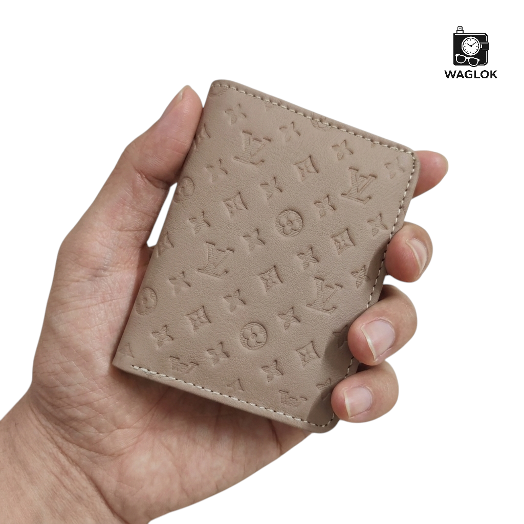 Beige slim wallet with embossed monogram pattern