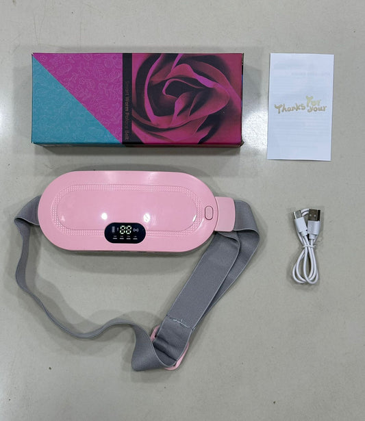 Pink electronic device with gray strap, box, and USB cable on a light gray surface
